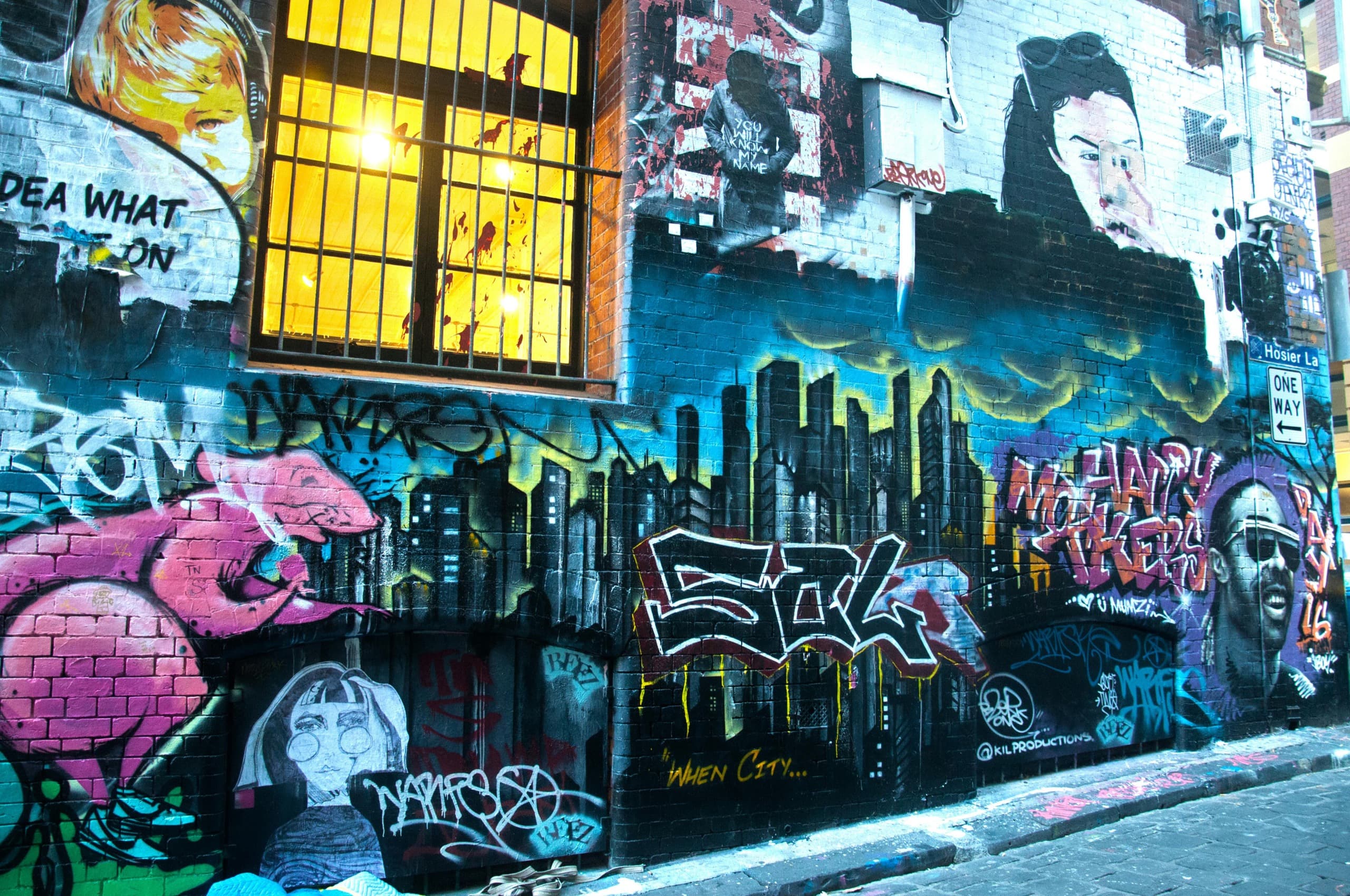 Vibrant graffiti-covered laneway wall